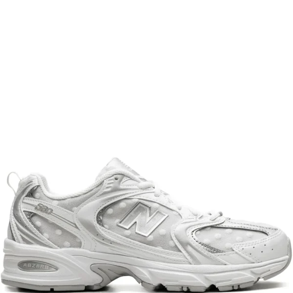 New Balance 530 sneakers in white and silver polka dot